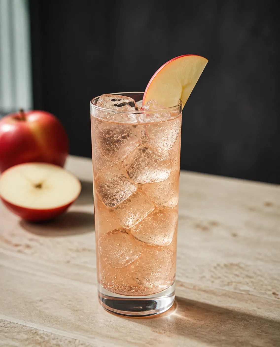 Apple Whiskey & Grapefruit Soda in a highball glass with grapefruit soda, to top and apple slice and lime wedge and chili-lime seasoning rim (optional) (AI-generated image)