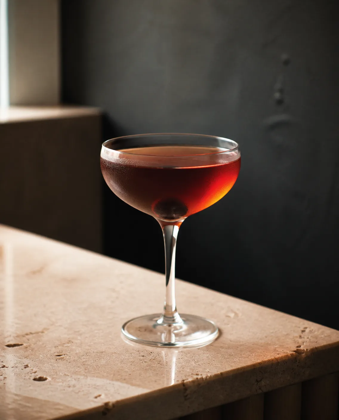 Perfect Tennessee Manhattan in a coupe with angostura bitters (a few dashes) and dark cherry (AI-generated image)